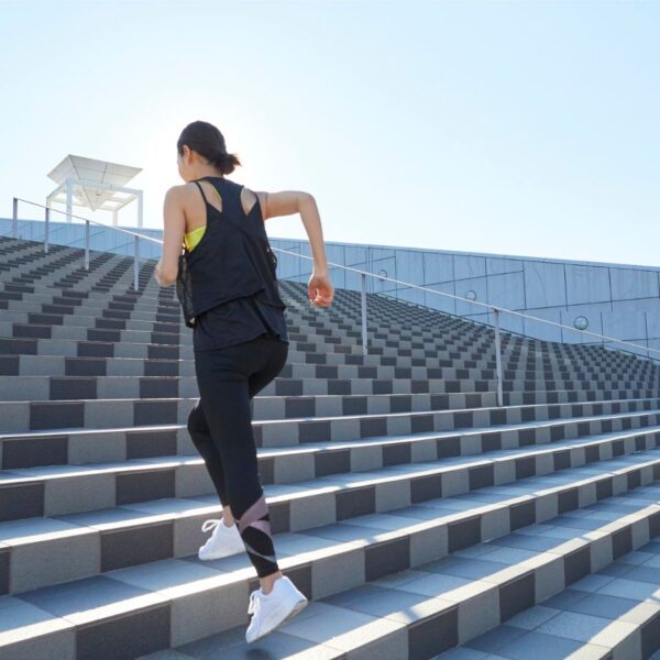 a woman running up stairs